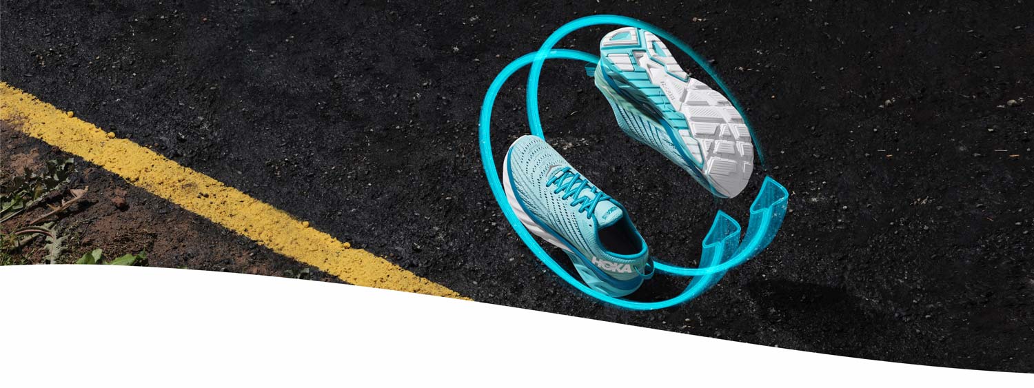 The HOKA Arahi 4 seen from the top and bottom with arrow graphics hovering over a street.